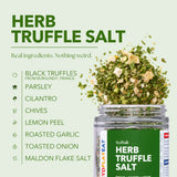 SydSalt Herb Truffle Salt in a clear jar with a green label, shown on a pale green background with ingredient callouts including black truffles from Burgundy, France, parsley, cilantro, chives, lemon peel, roasted garlic, toasted onion, and Maldon flake salt. Herb truffle salt is depicted spilling from the jar.