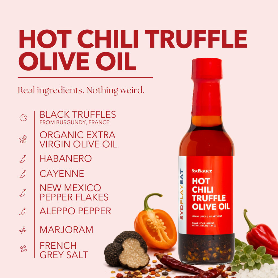 Ingredient guide for SydPlayEat Hot Chili Truffle Olive Oil, showing black truffles from Burgundy, organic extra virgin olive oil, habanero, cayenne, New Mexico and Aleppo pepper flakes, marjoram, and French grey salt.