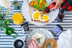 Breakfast with truffle salt and truffle oil with eggs avocado toast and bagel with cream cheese