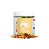 Jar of white truffle salt with visible contents on a white background