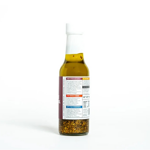 Bottle of olive oil with a label on a white background