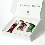 Gift set with truffle products in a white box on a white background