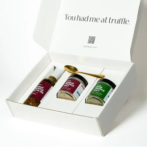 Gift set with truffle products in a white box on a white background