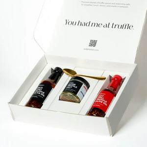 Gift set with truffle-themed products in a white box on a light gray background