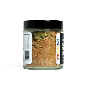 Jar of spice mix on a white background