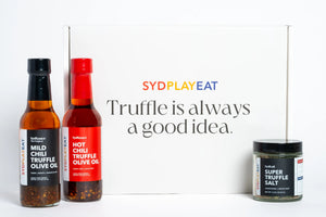 Three truffle oil bottles with 'SYDPLAYEAT' branding on a white background.